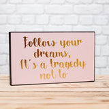 'Follow your dreams' plaque